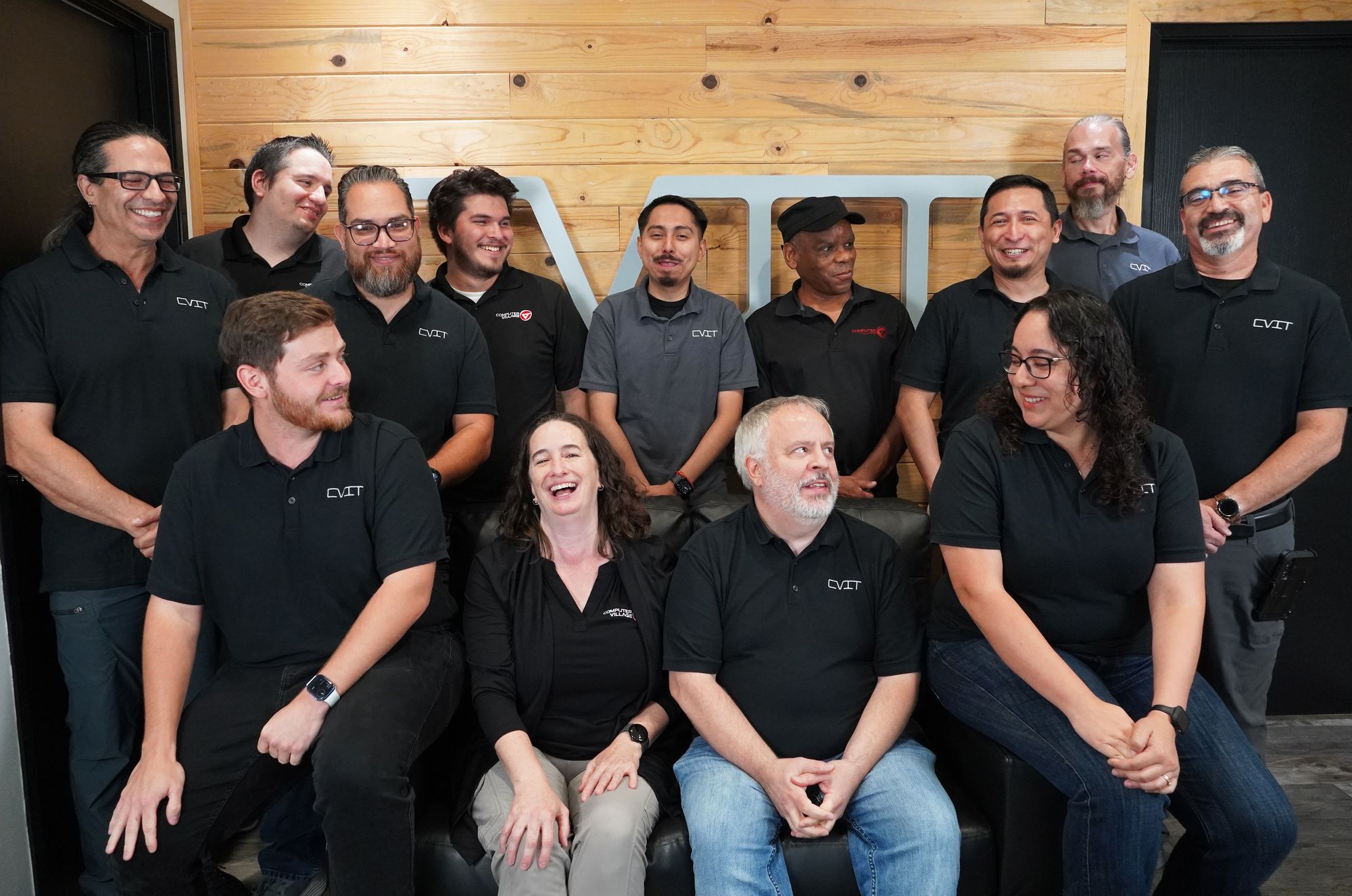 The Computer Village team together in front of the CVIT sign