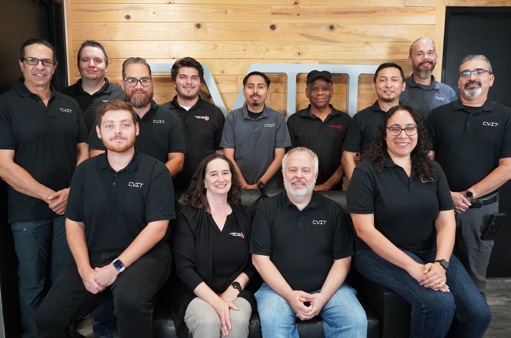 The Computer Village team together in front of the CVIT sign